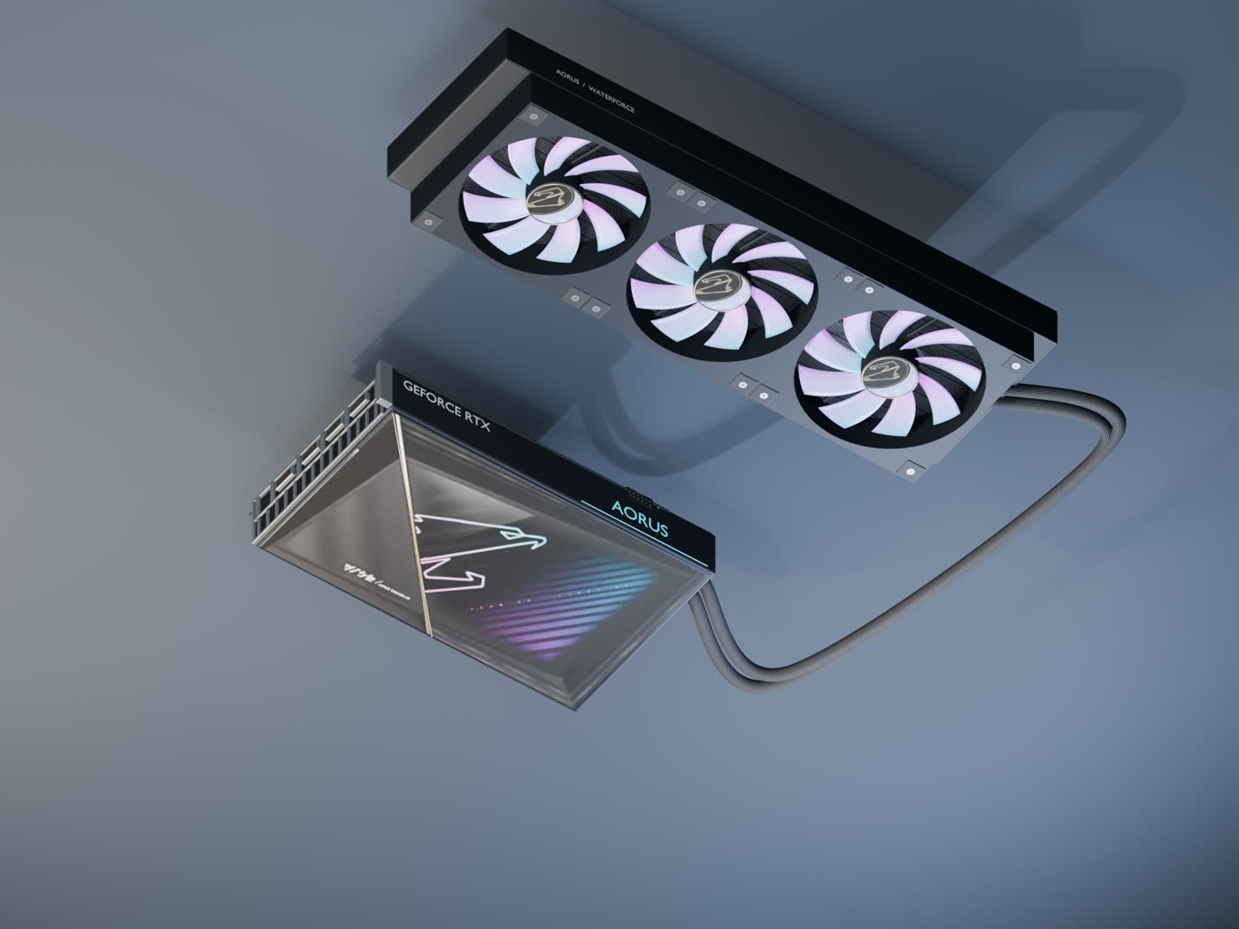 Gros plan sur une carte AORUS RTX 5090 WATERFORCE, son radiateur AIO et les tuyaux tressés.